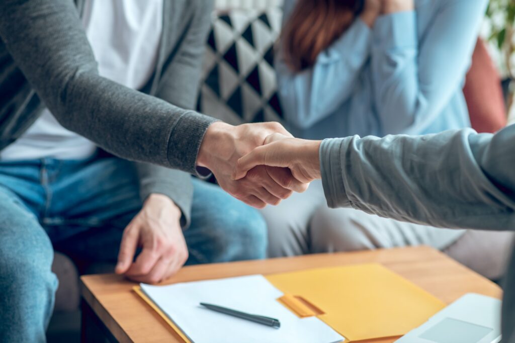 Hands in handshake in making deal