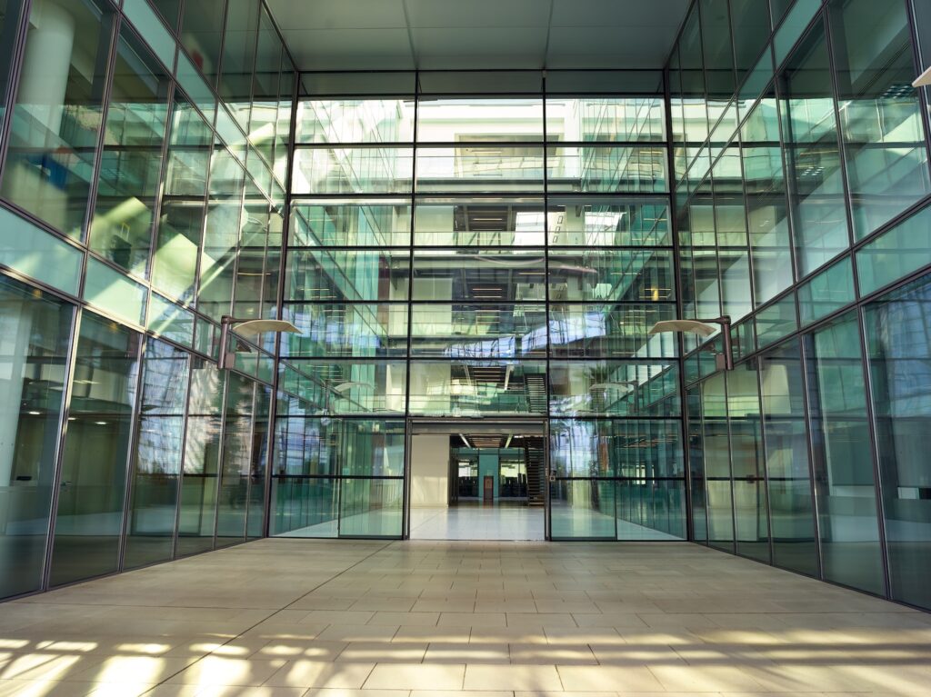 Interior View From Modern Office Lobby Of Empty Floors And Staircases