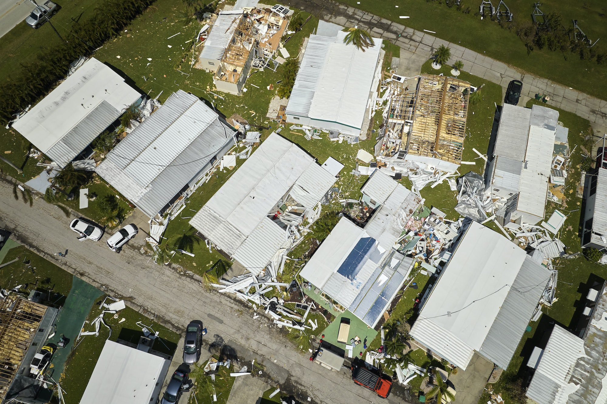 Hurricane Ian destroyed homes in Florida residential area. Natural disaster and its consequences