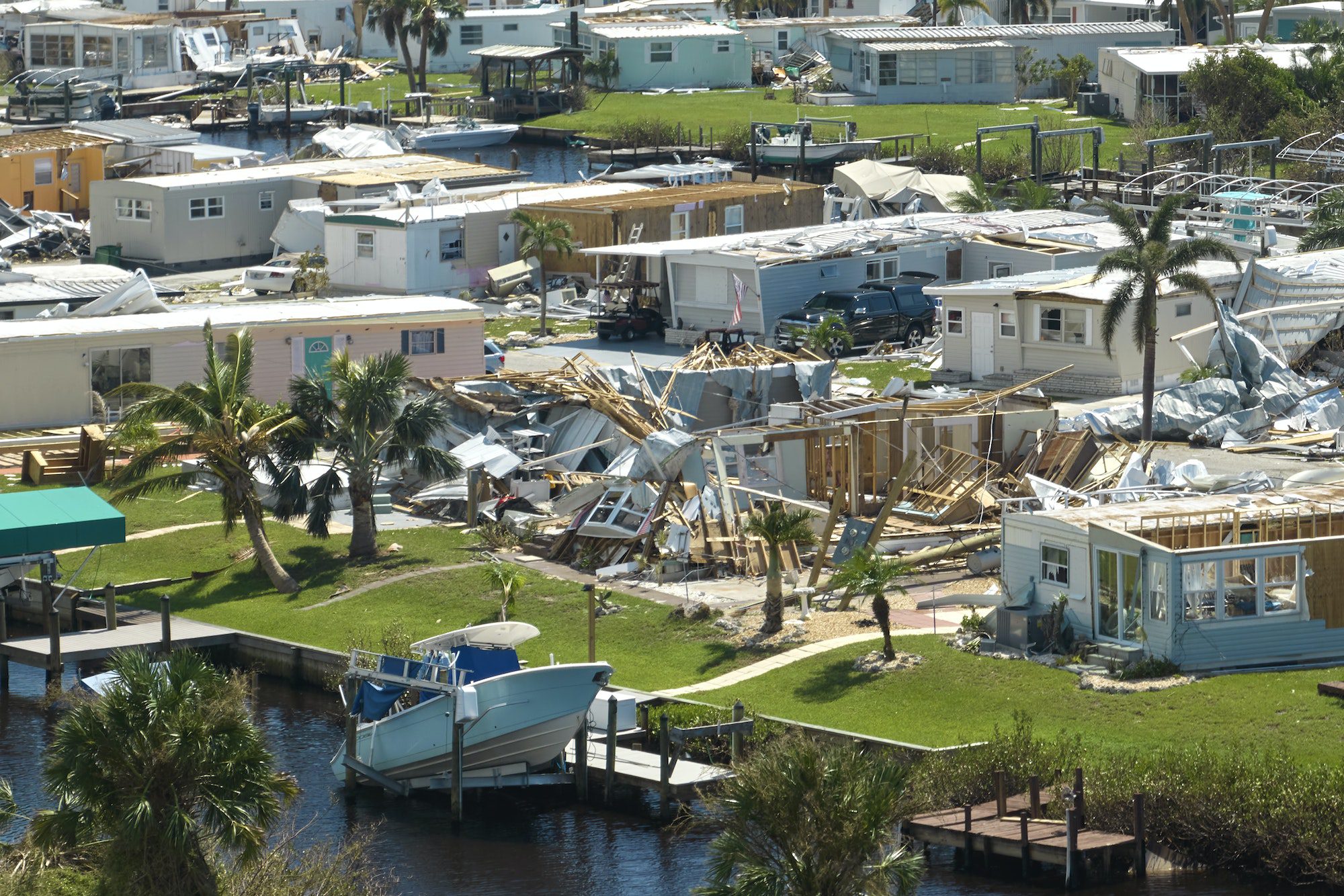 Hurricane Ian destroyed homes in Florida residential area. Natural disaster and its consequences