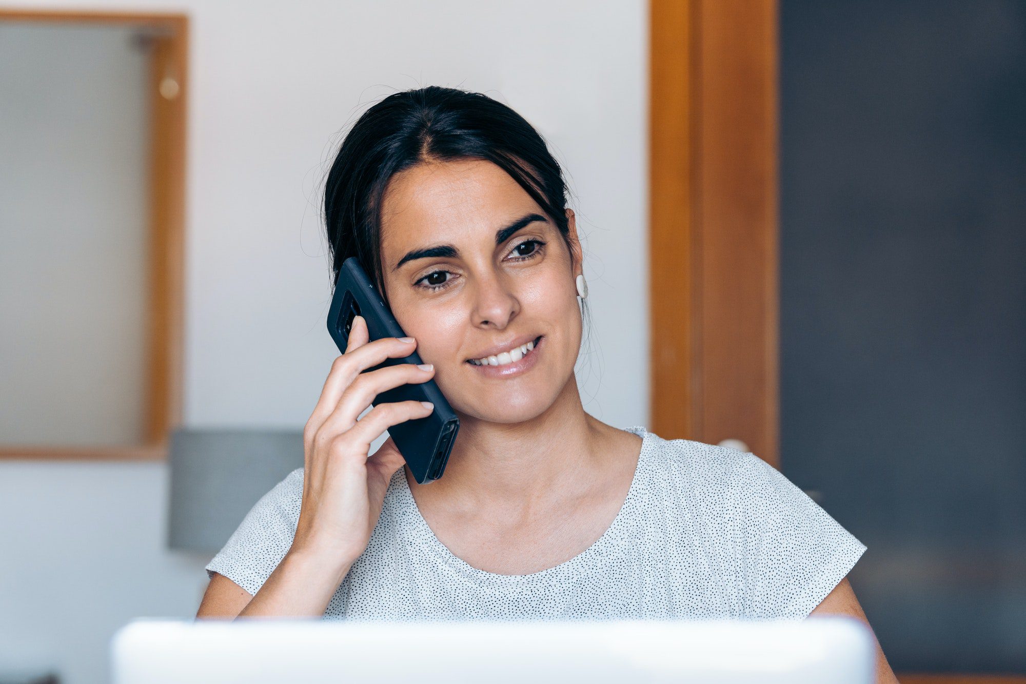 Craftswoman Talking on the Phone